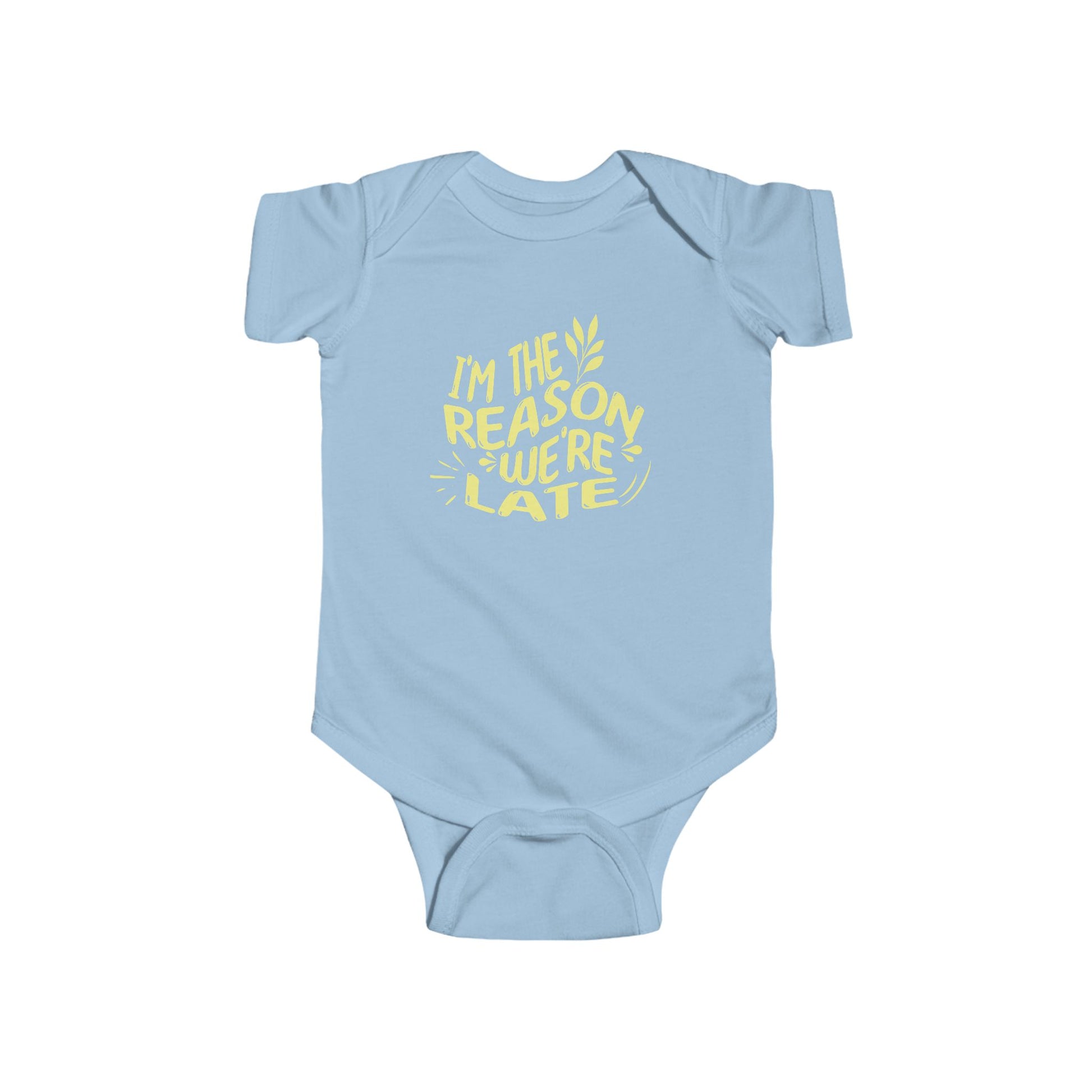 light blue infant bodysuit that says I'M THE REASON WE'RE LATE in yellow wavy lettering on the front.