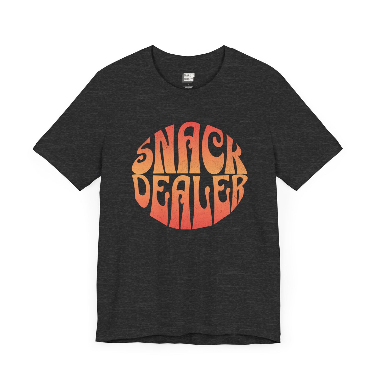 A dark grey mom t-shirt featuring a retro, orange gradient font with the words SNACK DEALER printed inside a circular design.