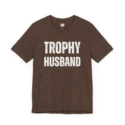 funny t shirt for men in brown that says TROPHY HUSBAND in bold white lettering