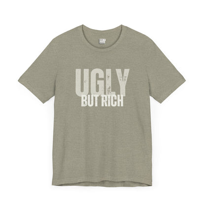 funny t shirt in stone that says UGLY BUT RICH in bold white lettering