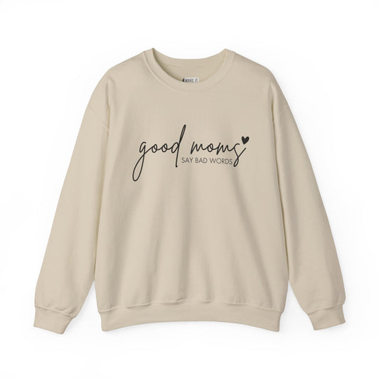 Sand-colored Mom Sweatshirt with the words GOOD MOMS in black cursive and the words SAY BAD WORDS in print text with a black heart detail.