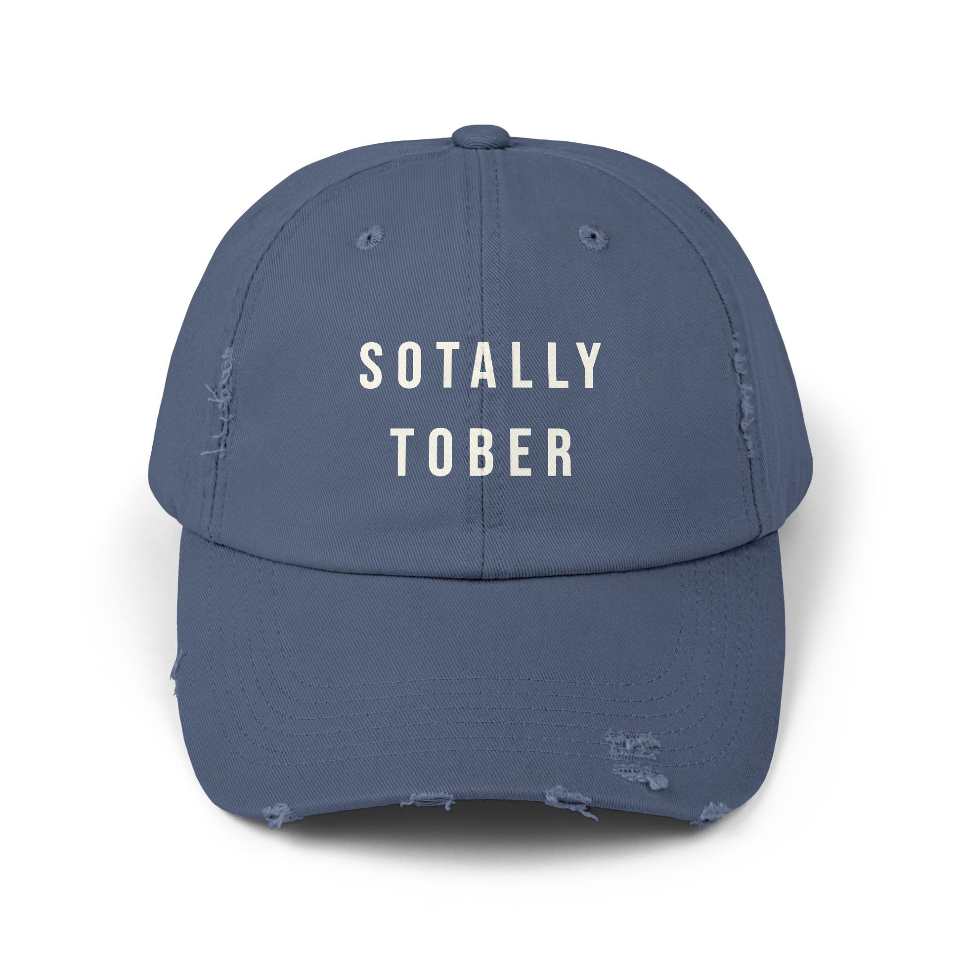 Blue baseball cap that says SOTALLY TOBER in bold letters on the front.