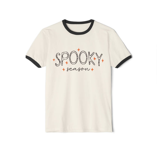 The "Spooky Season" Unisex Cotton Ringer Halloween T-Shirt in natural with black trim features playful black lettering and orange stars.