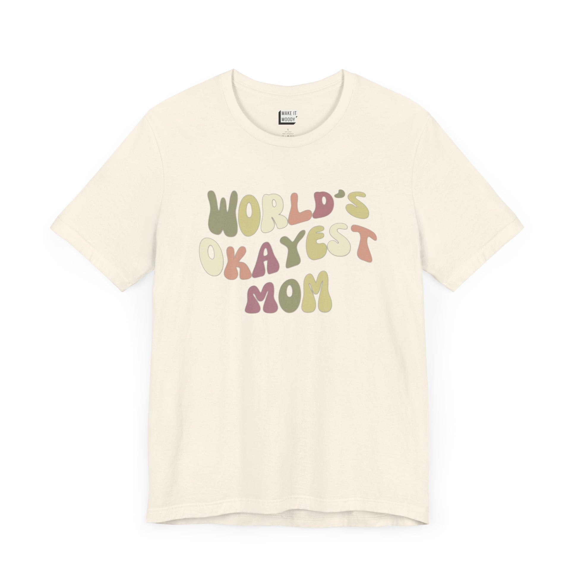 Off-white mom t-shirt with colorful, playful text that reads WORLD'S OKAYEST MOM.