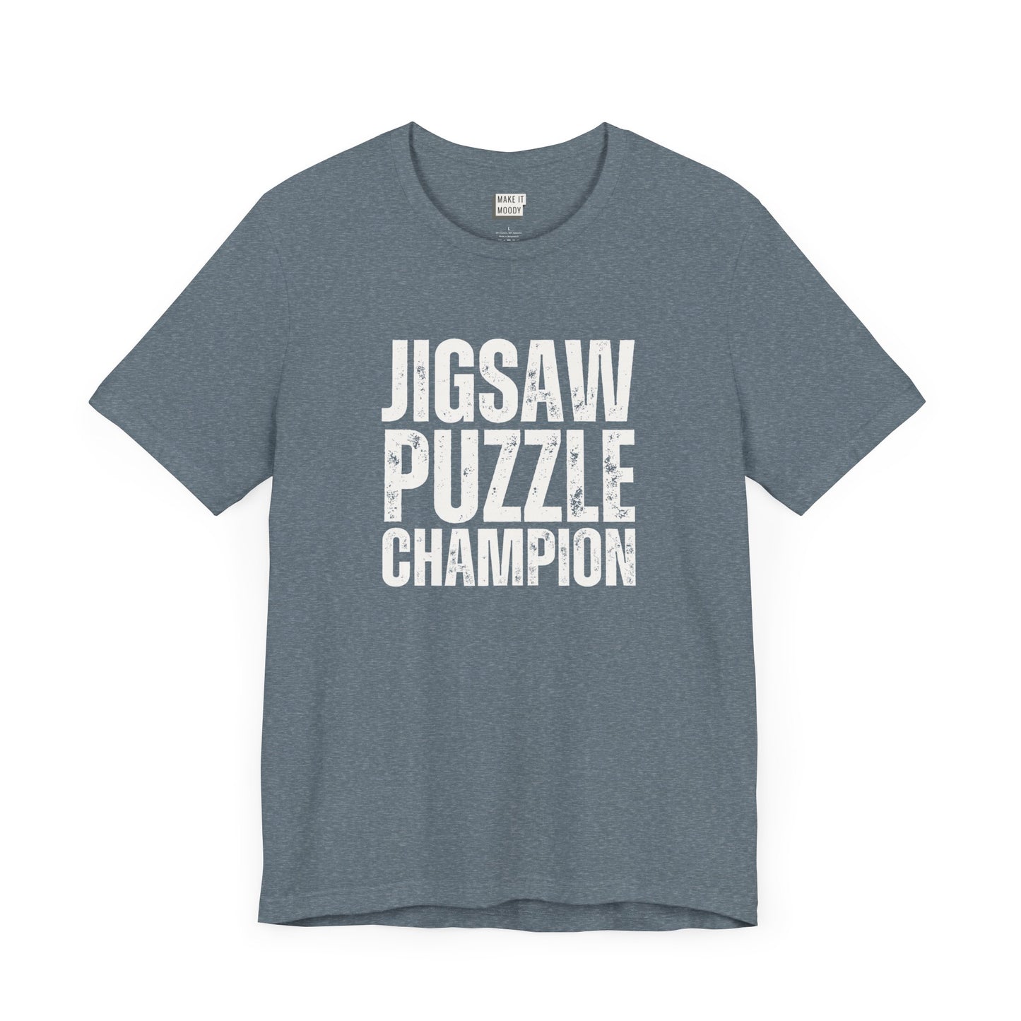 funny graphic t shirt in slate blue that says JIGSAW PUZZLE CHAMPION in bold white lettering