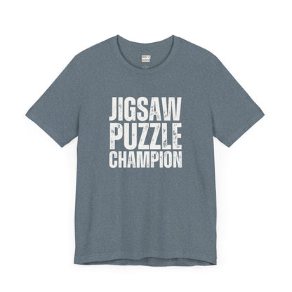 funny graphic t shirt in slate blue that says JIGSAW PUZZLE CHAMPION in bold white lettering