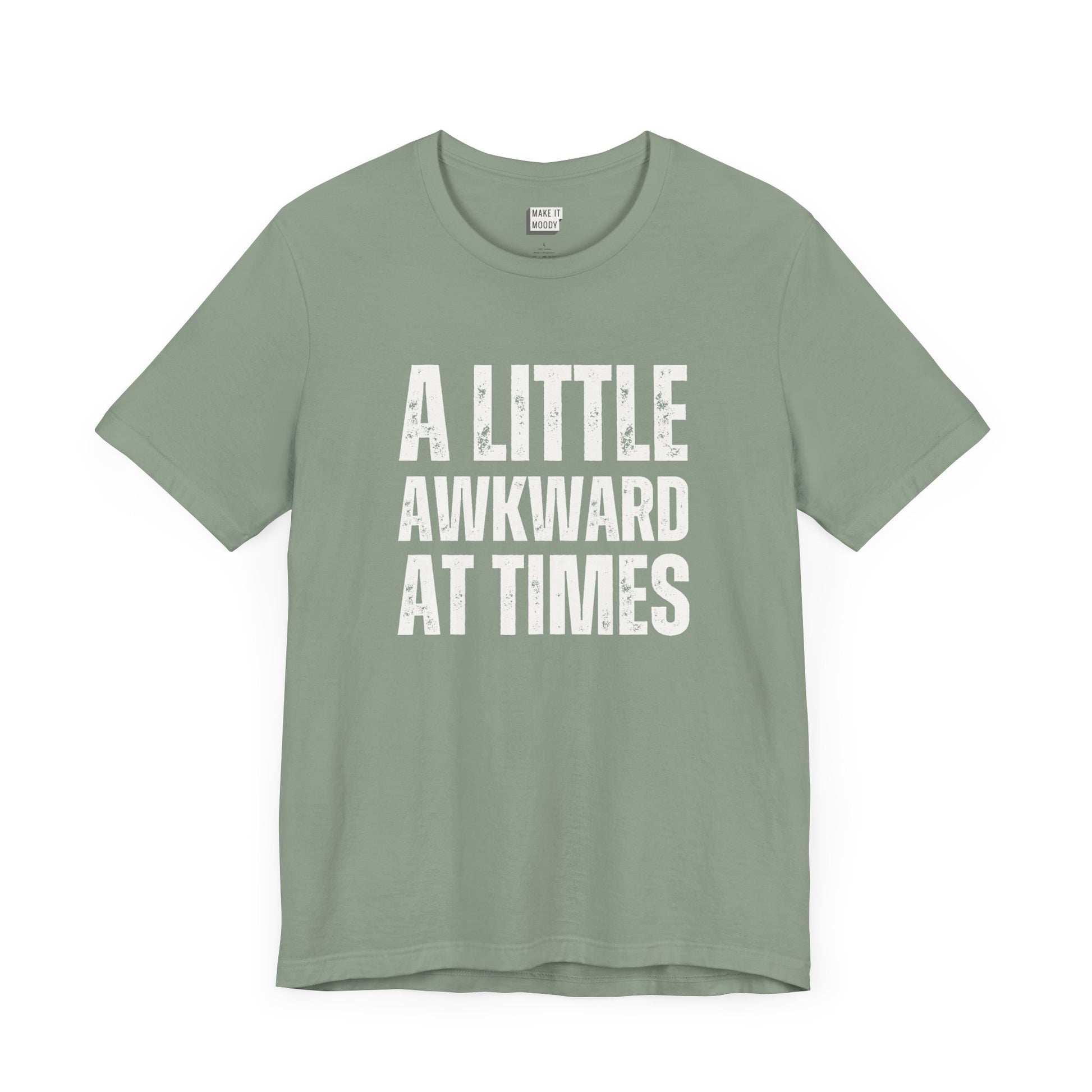 funny t shirt in sage green that says A LITTLE AWKWARD AT TIMES in bold white lettering