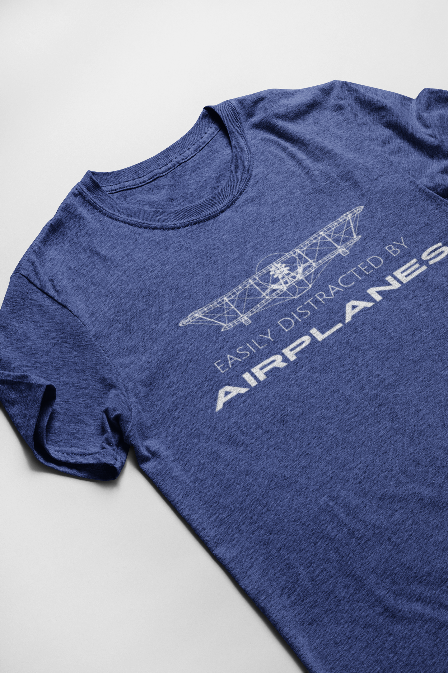 blue aviation tshirt that says easily distracted by airplanes with an airplane graphic on it