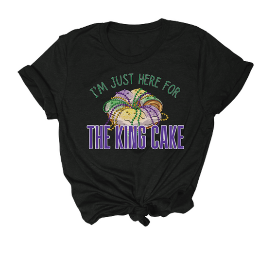 mardi gras themed tshirt that says i'm just here for the king cake
