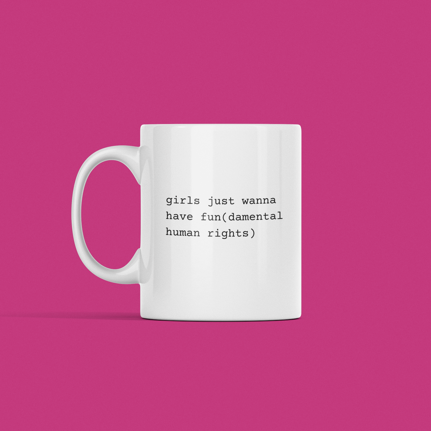 Girls Just Wanna Have Fundamental Human Rights Mug displayed against a pink background, featuring the message "girls just wanna have fun(damental human rights)" printed in black.